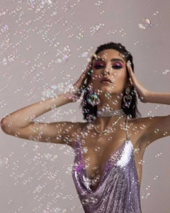 Detailed view of shimmering purple metal sequin party dress with diamond choker