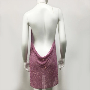 Detail of pink rhinestone backless party dress featuring shimmering crystals and metal chains