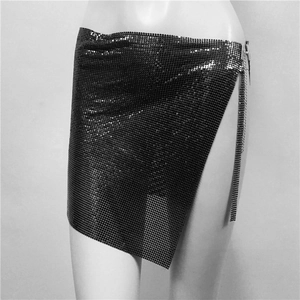 Close-up of black metallic sequin skirt with mesh texture and side chain detail