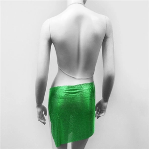 Detail of neon green metal sequin mini skirt with chain belt for party wear