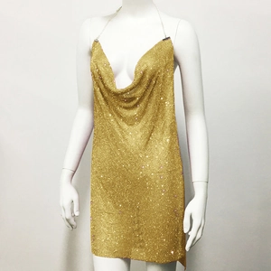 Close-up of gold metallic mesh fabric on a sexy deep V-neck halter party dress