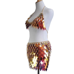 Detail of sequin bikini set with gold metal chains and diamond rainbow sequins