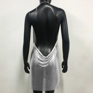 Close-up of sexy silver metallic sequin backless dress with a thin chain neck strap