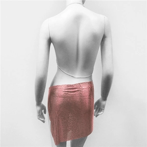 Detailed view of pink metal mesh sequin mini skirt with delicate chain waist detail