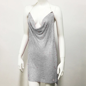 Detailed view of silver metallic mesh halter dress with pink rhinestones and V-neck
