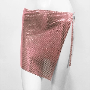 Detail of rose pink metal mesh mini skirt with side chain and asymmetrical hemline