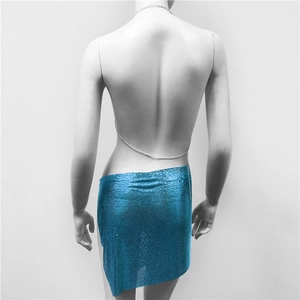Close-up of bright blue sequin mini skirt with metallic mesh and chain link back detail