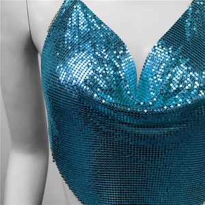Detailed close-up of blue metallic sequin crop top with chain straps for party wear