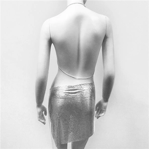 Detail of silver metallic mesh backless top with delicate chain straps for party wear