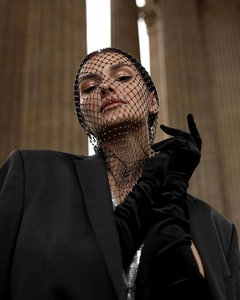 Detailed view of fashionable black rhinestone mesh face mask with elegant crystal mesh veil