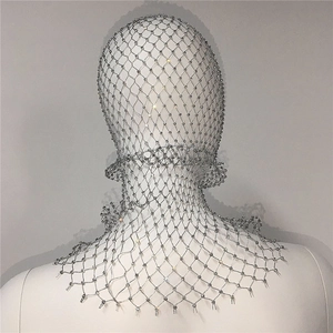 Close-up of sparkling rhinestone mesh headpiece showing intricate silver metal grid work