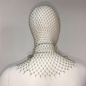Detail showing the intricate silver mesh texture and sparkling rhinestones on the headpiece