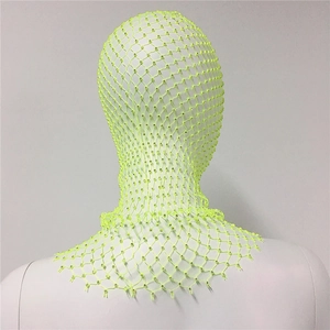 Detailed close-up of neon green rhinestone fishnet headpiece on a display mannequin