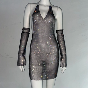 Detail of silver metal mesh mini dress with rhinestones and matching long gloves