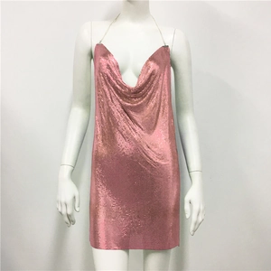 Detail of rose gold sequin metal mesh fabric and deep V-neck on party dress