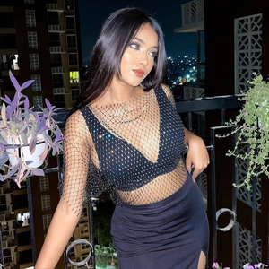 Close-up of black mesh fishnet top with sparkling rhinestones for party wear
