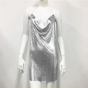Detail shot of silver metal sequin mini dress featuring a draped cowl neck and chain straps