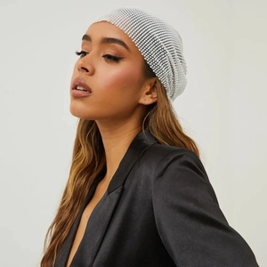 Close-up of a white pearl beaded fishnet headscarf with an elegant woven mesh design