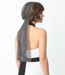 Macro detail of black fishnet headscarf with sparkling rhinestones for party wear