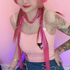 Pink sequin mesh scarf accessory styled with Y2K fashion for a trendy feminine look