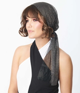 Close-up of sparkling rhinestones on black mesh turban with tie-up detail for festivals