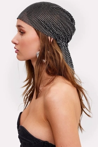 Detail of a black mesh headscarf with sparkling silver rhinestones for festive events