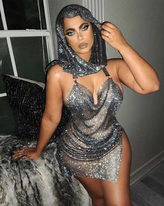 Detail of silver rhinestone metal mesh hooded dress with side slit and backless design
