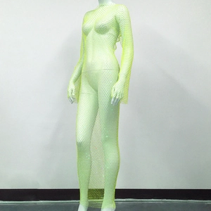 Detail view of neon yellow mesh dress with sparkling rhinestones and long sleeves