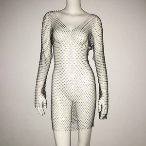 Close-up of black mesh mini dress featuring sparkly rhinestones and deep V-neckline