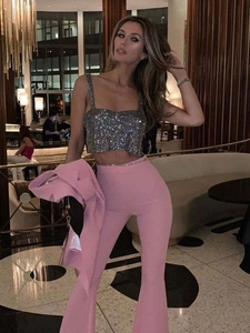 Sparkly silver sequin crop top and pink flared trousers evening party outfit set