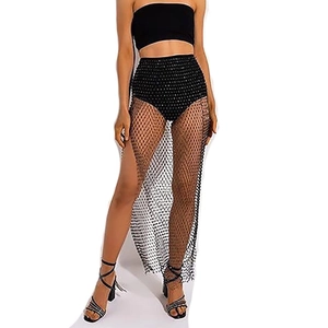 Detail view of black high-waisted rhinestone fishnet maxi skirt for beach or party wear