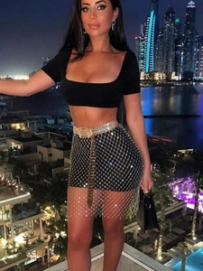 Sexy black fishnet mini skirt with silver rhinestones and a sparkling waist belt