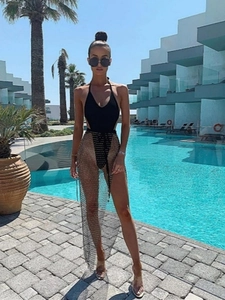 Women's black halter swimsuit with a sparkling rhinestone fishnet slit maxi skirt