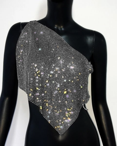 Detailed view of silver rhinestone mesh single-shoulder top with triangle hem on mannequin