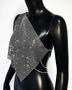 Side view of silver rhinestone chain halter top on mannequin for music festivals