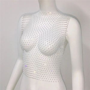 Close-up of white rhinestone fishnet tank top with sparkling crystals for party wear
