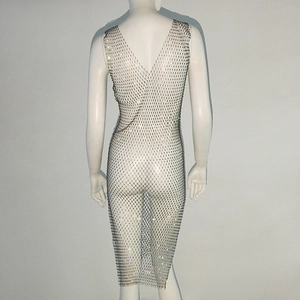 Close-up of white mesh backless dress with sparkling colorful rhinestones for party wear