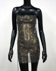 Close-up of sparkling colorful rhinestones on a black mesh mini party dress