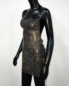 Detailed view of black mini dress with colorful shimmering rhinestones on thin straps