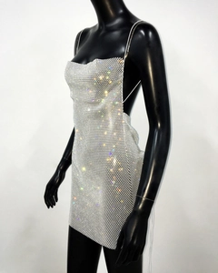 Detailed view of shimmering silver rhinestone mini dress with delicate straps and open back