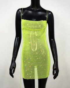 Detail of neon green mesh mini dress with shimmering rhinestones and halter straps