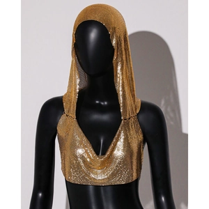 Detailed close-up of a gold metal mesh hooded vest with shimmering chainmail texture