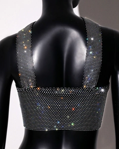 Detailed view of black rhinestone crop top featuring shimmering crystals and wide straps