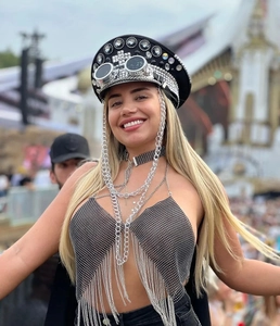 Close-up of festival halter top featuring metallic mesh and shimmering rhinestone fringe