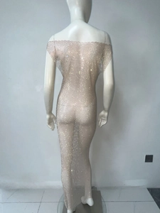 Detail of sheer mesh maxi dress with sparkling rhinestones and open back design