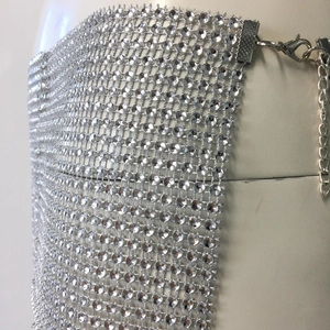 Detail of silver rhinestone mesh skirt featuring lobster clasp and adjustable metal chain