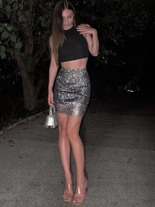 Sparkly rhinestone mini skirt with black halter top for women in party night club style