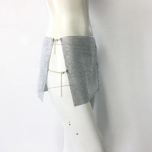 Detail view of silver rhinestone mini skirt with metal mesh and side chain adjustment
