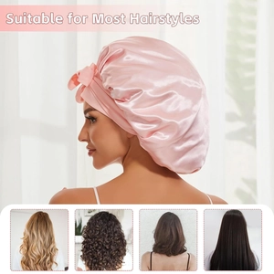 Pink satin sleeping bonnet with bow design for curly and long hair protection