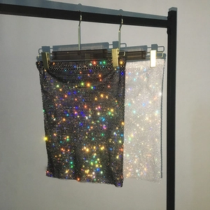 Close-up of sparkling rhinestone mesh skirts in black and white for party wear